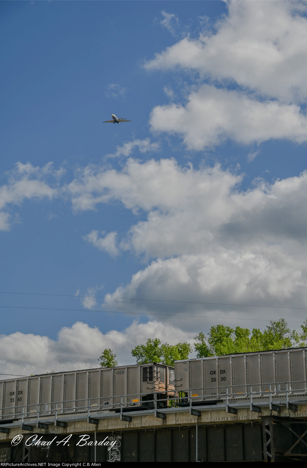 PLANE OVER COAL TRAIN